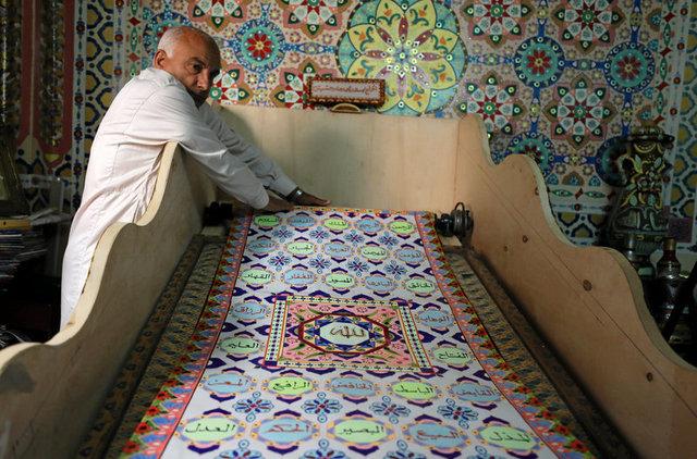 خطاط مصري يسعى لدخول موسوعة جينيس بمصحف طوله 700 متر