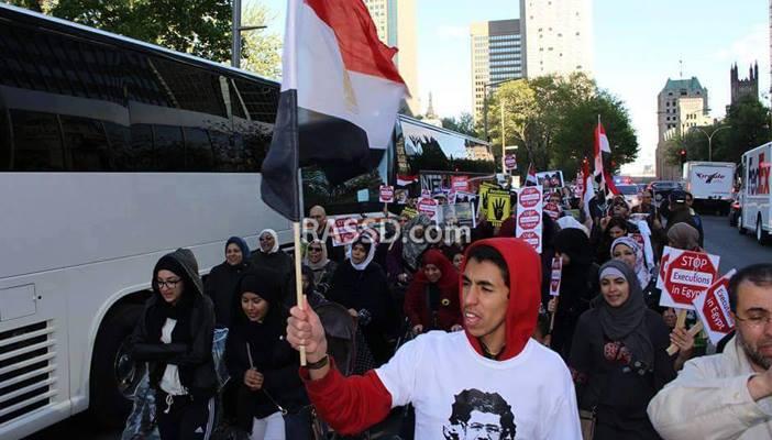 بالصور.. الجالية العربية بكندا تطلب طردالسفير المصري بسبب إعدام مرسي