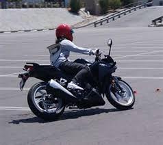 مصرى يقود دراجة نارية من سويسرا لليابان رافعاً علم مصر