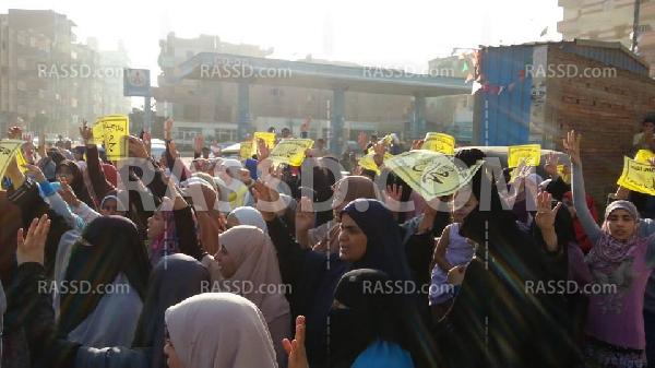 وقفة إحتجاجية لحركة نساء ضد الانقلاب في “الغربية”