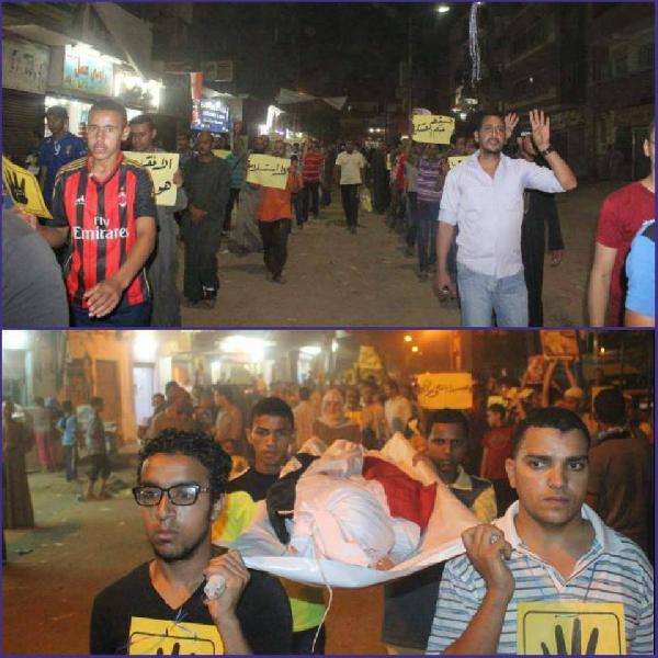 مسيرة صامته يتقدمها نعش بالقوصية إحياءً لذكرى الشهداء أمس