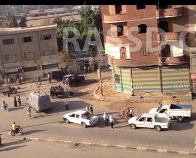 قوة أمنية تتجه لشارع المدارس بالفيوم