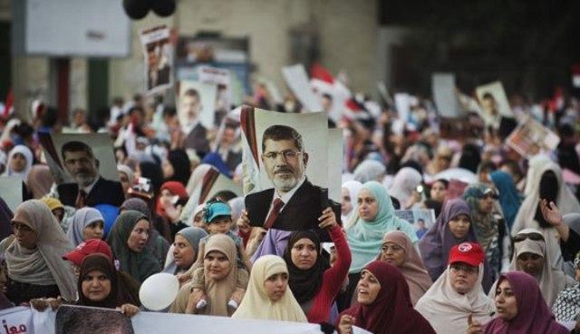 اعتقال سيدة وطفلها في مسيرة رافضة للانقلاب بقنا