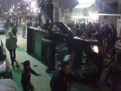 تحطيم سيارة لأمن الأنقلاب حاولت دهس متظاهرين بأسيوط